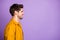 Photo of cheerful confident man with perfect posture looking into empty space with face unshaven isolated violet pastel