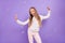 Photo of cheerful crazy funky little lady have fun soap bubble fly wear dotted pajama isolated purple color background