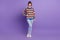 Photo of cheerful cute dream lady wear striped pullover jeans footwear isolated violet color background