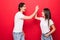 Photo of cheerful cute nice positive pretty boyfriend students girlfriend clapping their palms giving high five smiling toothily