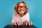 Photo of cheerful excited man toothy smile write keyboard coworking isolated on blue color background