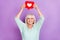 Photo of cheerful funny influencer user old lady hold icon heart raise hands wear teal shirt isolated violet color