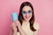 Photo of cheerful glad lady enjoy tourism weekend trip hold plastic soda cup on pink background