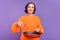 Photo of cheerful grandma cook tasty lunch frying pan healthy food isolated over purple color background