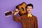 Photo of cheerful guitarist guy hold guitar shoulder wear bow tie checkered shirt isolated violet background