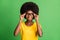 Photo of cheerful happy nice dark skin woman hold wear glasses good mood isolated on green color background