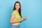 Photo of cheerful happy positive young woman hold phone post comment like blog isolated on blue color background