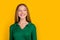 Photo of cheerful lovely girl beaming smile look empty space fantasize isolated on yellow color background