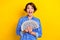 Photo of cheerful positive lady hold money rejoice win lottery jackpot luxury life isolated on yellow color background