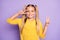 Photo of cheerful positive preteen showing you double v-sign in good mood  pastle violet color background