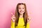 Photo of cheerful pretty cute lady wear yellow trendy outfit arm hold candies sugary sweets addiction isolated on pink