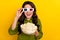 Photo of cheerful surprised lady hold pop corn watch funny plot twist wear 3d glasses shirt isolated yellow color