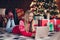 Photo of cheerful sweet small girl wear red print sweater chatting new year xmas greetings modern device indoors house