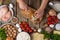 In the photo, the chef prepares pieces of dough for the filling. Lots of bright, colorful ingredients. Rough wooden table. Bright