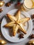 Photo Of Christmas Golden Star Reflecting On A Glass Of Eggnog Beside Mince Pies. Generative AI