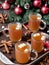 Photo Of Christmas Mugs Of Spiced Cider On A Tray. Generative AI