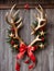 Photo Of Christmas Reindeer Antlers Wrapped With Red Ribbons And Golden Stars, Leaning Against A Barn Door. Generative AI