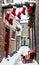 Photo Of Christmas Stockings Hanging From A Sleigh Filled With Mince Pies In A Snowy Alleywa. Generative AI