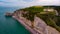 Photo of cliffs and Chapelle Notre dame de la Garde taken by drone. France, Normandy, Etretat.