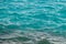 Photo closeup of beautiful clear turquoise sea ocean water surface with ripples low waves on seascape background