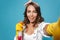 Photo closeup of cheerful housewife 20s in yellow rubber gloves