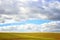 Photo of cloudscape and meadow view