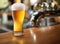 Photo of cold beer glass on a bar.