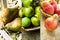 Photo collage autumn seasonal fruits, red and brown pears, green organic apples in wicker basket, farming, harvest, thanksgiving