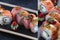 Photo collage rolls with smoked salmon and strawberries. Philadelphia cheese. Kaisen rolls. Dark background. Vegetarian