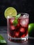 Photo Of Collins Glass Of Red Wine Cocktail Mixed With Ice Cube, Mint Leaves And Lime. Generative AI