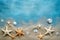 Photo of a colorful collection of starfish and seashells on a sandy beach