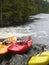 Photo of Colourful kayaks by river