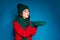 Photo of comfort cozy girl in woolen hat gloves hold hand blow winter x-mas atmosphere spirit snowy snow flakes wear