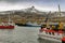 Photo of a commercial fishing dock in the small city. These fishing vessels are a key part of the Icelandic economy and