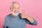 Photo of confident funny retired man grey sweater showing thumb up isolated pink color background