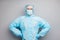 Photo of confident guy expert virologist doc center clinic arms by sides professional wear face mask hazmat blue uniform