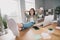 Photo of confident lady boss hands hold behind head rejoice enjoy finish work day dream summer vacation sit comfort room