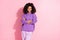 Photo of confident shiny african lady dressed purple hoodie smiling hands folded isolated pink color background