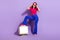 Photo of confident successful optimistic lady wear stylish clothes stand old box monitor empty space isolated on purple