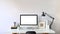 Photo of Contemporary Workspace..White blank screen monitor on modern working desk. Equipment on table.