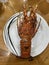 Photo of cooked lobster or banagan on plate Philippine seafood