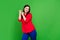 Photo of cool brunette young lady dance wear red shirt isolated on green color background