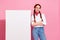 Photo of cool confident lady dressed cowboy outfit arms crossed placard empty space isolated pink color background