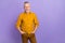 Photo of cool elder grey hairdo man wear yellow shirt isolated on purple color background