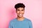 Photo of cool funny dark skin man wear blue jumper smiling isolated pastel pink color background