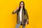 Photo of cool young lady hold laptop thumb up wear spectacles shirt isolated on yellow background