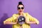 Photo of crazy cool millennial girl hold glitter discotheque ball scream  over purple color background