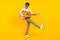 Photo of crazy performer guy hold guitar play song wear suspenders shirt isolated yellow color background
