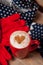 Photo of cup of coffee, scarf and gloves on thw wonderful brown