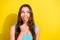 Photo of curious brunette hairdo young lady lick sweet look empty space wear teal top isolated on vivid yellow color